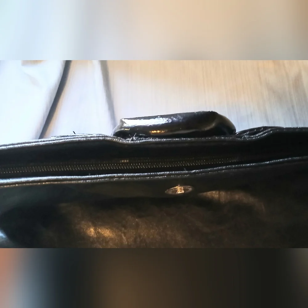 NOATD Elegant Black Clutch with Floral Design.